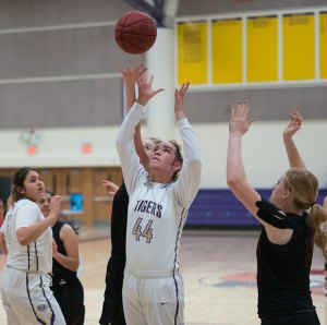Tiger hoop squads end woeful season with losses to Bullpups in season finales Brianna Moroles takes a shot in Tuesday night's final against Hanford.